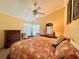 Bedroom featuring a vaulted ceiling and large windows at 741 Canberra Rd, Winter Haven, FL 33884