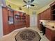 Bedroom with custom cabinets, built-in desk, and french doors in the background at 741 Canberra Rd, Winter Haven, FL 33884