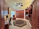 Spacious bedroom with custom built-in shelving, desk and cabinets, and overhead lighting at 741 Canberra Rd, Winter Haven, FL 33884