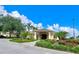 Attractive clubhouse exterior surrounded by lush landscaping and manicured lawns on a sunny day at 741 Canberra Rd, Winter Haven, FL 33884