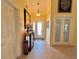 Bright foyer featuring tile floors and elegant decor at 741 Canberra Rd, Winter Haven, FL 33884