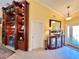 Bright foyer features an elegant display cabinet and detailed trim work at 741 Canberra Rd, Winter Haven, FL 33884