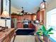Kitchen features wooden cabinets, stainless steel appliances, granite countertops, and an adjacent breakfast nook at 741 Canberra Rd, Winter Haven, FL 33884