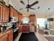 Kitchen features include wooden cabinets, granite countertops, and stainless steel appliances at 741 Canberra Rd, Winter Haven, FL 33884