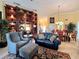 Comfortable living room with cozy seating, statement built-ins, and an open concept layout at 741 Canberra Rd, Winter Haven, FL 33884