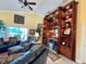 Bright living room featuring custom built-ins with bar, cozy seating, and an open floor plan at 741 Canberra Rd, Winter Haven, FL 33884