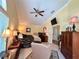Bright main bedroom features a ceiling fan, tv, walk-in closet, and stylish furnishings at 741 Canberra Rd, Winter Haven, FL 33884