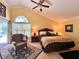 Main bedroom with bright natural light, a ceiling fan, and an elegant interior design at 741 Canberra Rd, Winter Haven, FL 33884