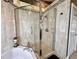 Updated shower with glass door showcasing tile surround and updated fixtures at 741 Canberra Rd, Winter Haven, FL 33884