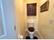 Toilet room with wood-look floors and matching cabinet at 741 Canberra Rd, Winter Haven, FL 33884