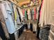Organized walk-in closet providing ample storage for clothing and shoes at 741 Canberra Rd, Winter Haven, FL 33884