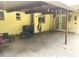 Covered patio area providing a comfortable outdoor space for entertaining and enjoying the backyard view at 8110 Walt Williams Rd, Lakeland, FL 33809