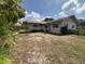Large backyard featuring scattered trees and a view of the house at 816 Casselberry Dr, Lake Wales, FL 33853