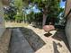 Large backyard with mature trees and an outdoor grill provides great outdoor space at 816 Casselberry Dr, Lake Wales, FL 33853