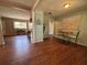 Inviting dining area featuring wood floors and views into adjacent rooms at 816 Casselberry Dr, Lake Wales, FL 33853