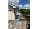 The paved driveway stretches alongside this home with a single car garage at 816 Casselberry Dr, Lake Wales, FL 33853