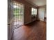 Inviting entryway with new laminate flooring, security door and natural light from window by the front door at 816 Casselberry Dr, Lake Wales, FL 33853