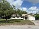 Charming single-Gathering home with a well-maintained lawn and attached one car garage at 816 Casselberry Dr, Lake Wales, FL 33853