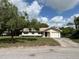 Charming single-Gathering home with a well-maintained lawn and attached one car garage at 816 Casselberry Dr, Lake Wales, FL 33853