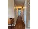 Hallway with hardwood floors connecting multiple rooms at 816 Casselberry Dr, Lake Wales, FL 33853