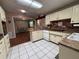 Spacious kitchen featuring white appliances, brick backsplash, and ample countertop space at 816 Casselberry Dr, Lake Wales, FL 33853