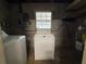 Functional laundry room featuring a washer and dryer, with practical utility connections at 816 Casselberry Dr, Lake Wales, FL 33853