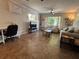 Spacious living room with comfortable seating, a TV area, a workspace desk and lots of natural light at 816 Casselberry Dr, Lake Wales, FL 33853