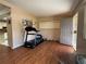 Spacious living room featuring hardwood floors and a door to the exterior at 816 Casselberry Dr, Lake Wales, FL 33853