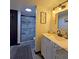 Bathroom featuring a walk-in shower with decorative tile and a vanity with a sink at 816 Pinewood Ct # 3126, Haines City, FL 33844