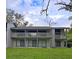 Two-story home with balconies, sliding doors, and well-maintained lawn at 816 Pinewood Ct # 3126, Haines City, FL 33844