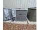 Three Carrier HVAC units sit on concrete pads surrounded by leaves at 816 Pinewood Ct # 3126, Haines City, FL 33844