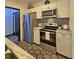 The well-equipped kitchen offers stainless steel appliances and decorative accents at 816 Pinewood Ct # 3126, Haines City, FL 33844