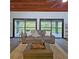 Open living area showcasing sliding glass doors, wood ceiling, and a neutral color palette at 816 Pinewood Ct # 3126, Haines City, FL 33844