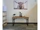 Entryway table with modern decor, artwork, and a standing lamp at 816 Pinewood Ct # 3126, Haines City, FL 33844
