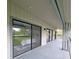 Extended covered patio with sliding glass doors for seamless entertaining at 816 Pinewood Ct # 3126, Haines City, FL 33844