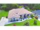 Lovely aerial view of a well-maintained home with mature landscaping and tile roof at 10708 Belo Horizonte Ave, Clermont, FL 34711
