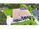 Aerial view of home featuring a pool, large backyard, and lush landscaping at 10708 Belo Horizonte Ave, Clermont, FL 34711