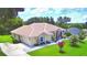 Expansive aerial view of a single-story home with mature landscaping and lush lawn at 10708 Belo Horizonte Ave, Clermont, FL 34711