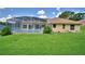 Spacious backyard features a screened-in pool and well-maintained lawn at 10708 Belo Horizonte Ave, Clermont, FL 34711