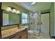 This bathroom offers a stone shower, marble vanity, and a decorative copper sink at 10708 Belo Horizonte Ave, Clermont, FL 34711