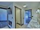 Bright bathroom featuring double vanities, a walk-in shower, a separate toilet, and neutral tones at 10708 Belo Horizonte Ave, Clermont, FL 34711