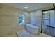 Bright bathroom features a freestanding tub, a window for natural light, and custom tilework at 10708 Belo Horizonte Ave, Clermont, FL 34711