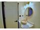 Stylish bathroom with a stone vessel sink, decorative mirror and tiled shower at 10708 Belo Horizonte Ave, Clermont, FL 34711