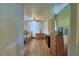 View of a bedroom with wood floors, a ceiling fan, a dresser, and curtains at 10708 Belo Horizonte Ave, Clermont, FL 34711
