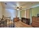 Cozy bedroom with wood floors, ceiling fan, and comfortable furnishings at 10708 Belo Horizonte Ave, Clermont, FL 34711
