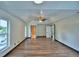 Bright primary bedroom offering hardwood floors, a ceiling fan, and plenty of natural light at 10708 Belo Horizonte Ave, Clermont, FL 34711