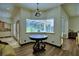 Bright dining area leads to screened outdoor lanai at 10708 Belo Horizonte Ave, Clermont, FL 34711