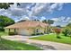 Charming single-story home with a well-manicured lawn and inviting curb appeal at 10708 Belo Horizonte Ave, Clermont, FL 34711