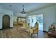 Comfortable seating area with hardwood floors, slider to the lanai, and great views from the doorway at 10708 Belo Horizonte Ave, Clermont, FL 34711