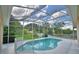 Enjoy this refreshing pool surrounded by a screened enclosure and manicured lawn at 10708 Belo Horizonte Ave, Clermont, FL 34711